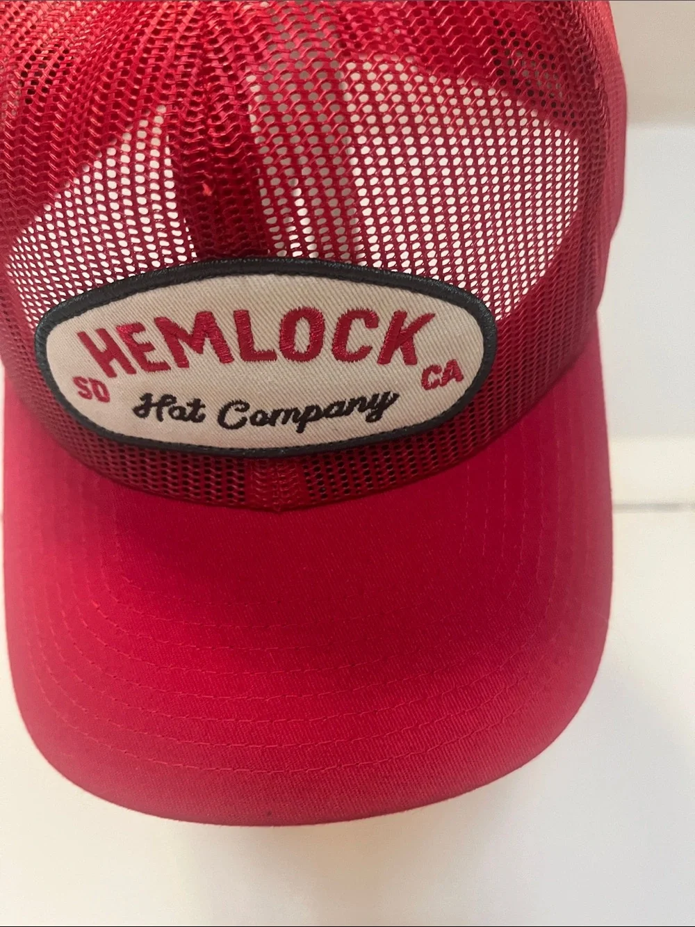 Hemlock Red Mesh Trucker Hat with Branded Patch